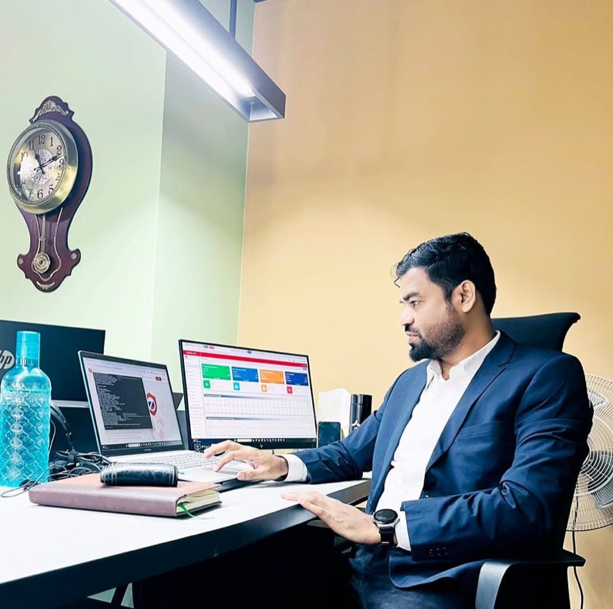 Ahmad Reza Shamim at work, reviewing a live product dashboard